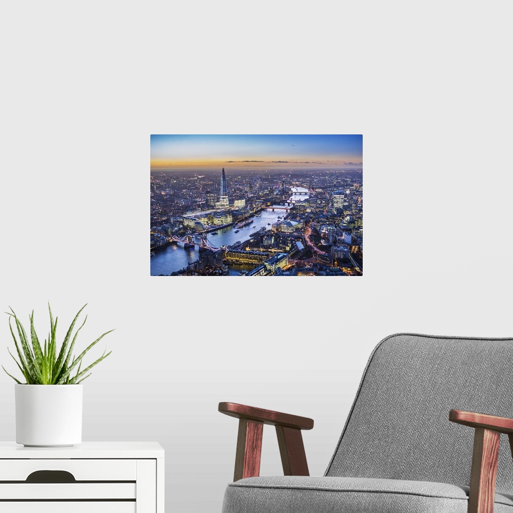 A modern room featuring Night aerial view of The Shard, River Thames, Tower Bridge and City of London, England