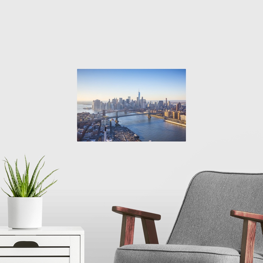 A modern room featuring One World Trade Center, Manhattan and Brooklyn Bridges, Manhattan, New York City, New York, USA.