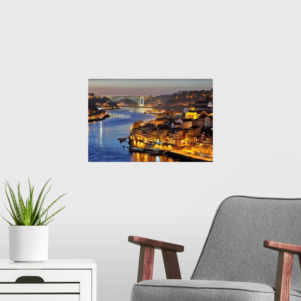 A modern room featuring Oporto. Ribeira, a Unesco World Heritage Site at dusk. Portugal