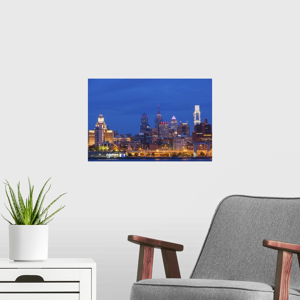 A modern room featuring USA, Pennsylvania, Philadelphia, city skyline from Camden New Jersey, dawn