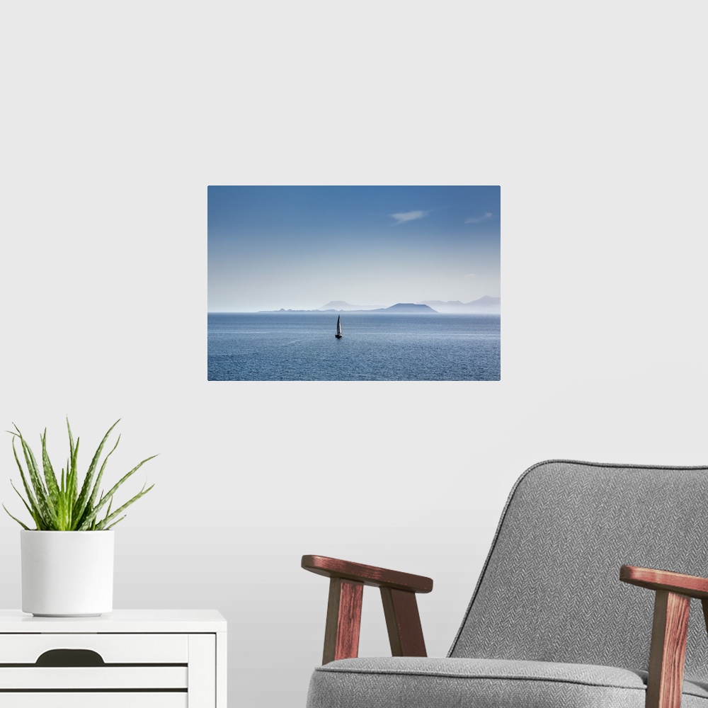 A modern room featuring Sailing boat and Fuerteventura, from Playa Blanca, Lanzarote, Canary Islands, Spain