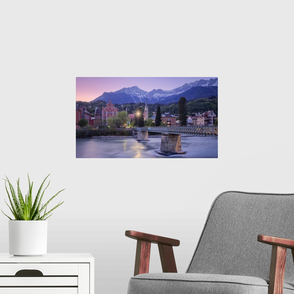 A modern room featuring Sankt Nikolaus district at dusk with the Nordkette mountain range in the background, Innsbruck, T...