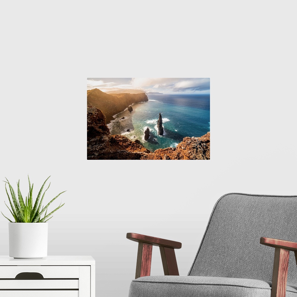 A modern room featuring The rocks, the sea and the cliff at sunset above the miradouro do San Lourenco, Madeira Island, P...