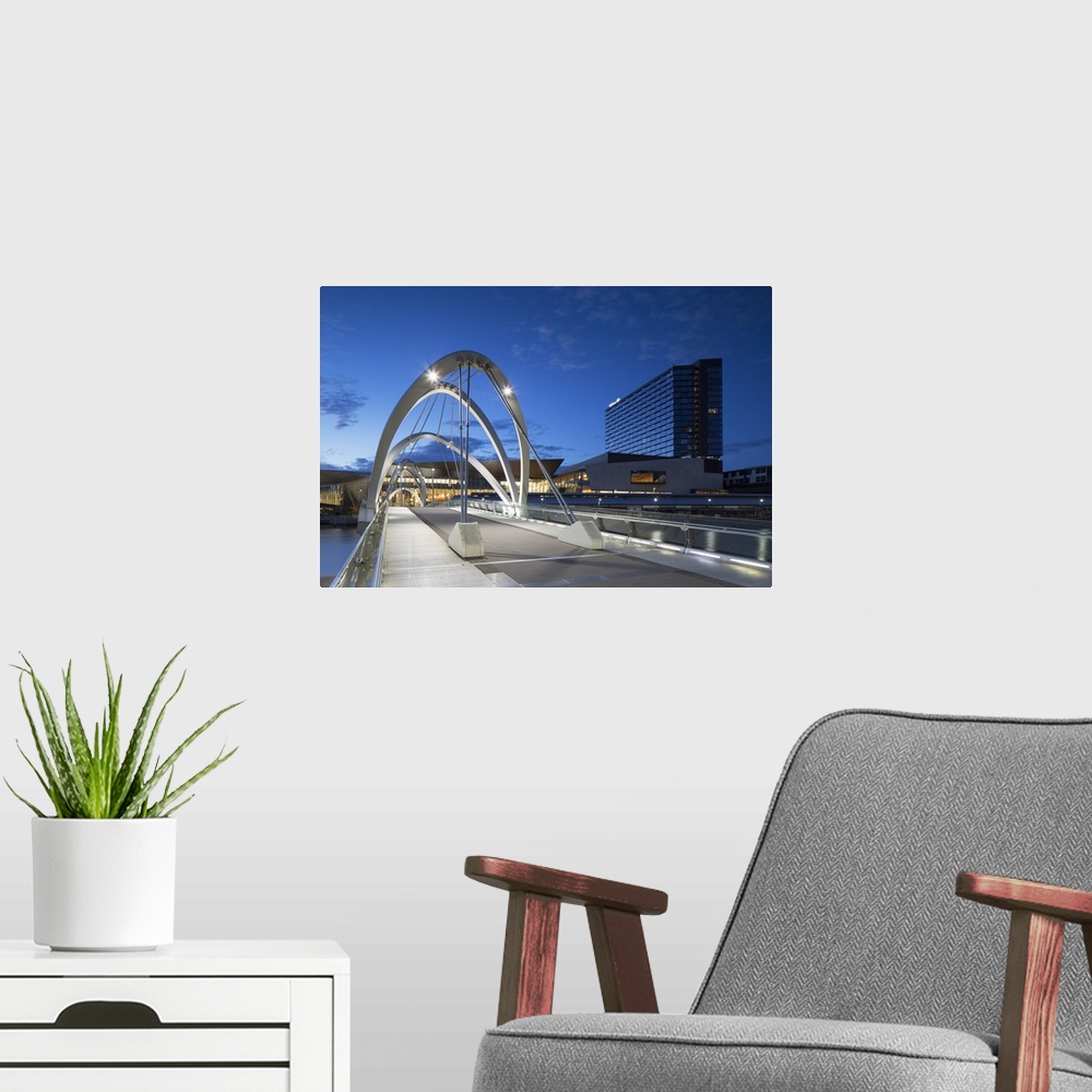 A modern room featuring Seafarers Bridge, Convention Centre and Hilton Hotel at dawn, Melbourne, Victoria, Australia.