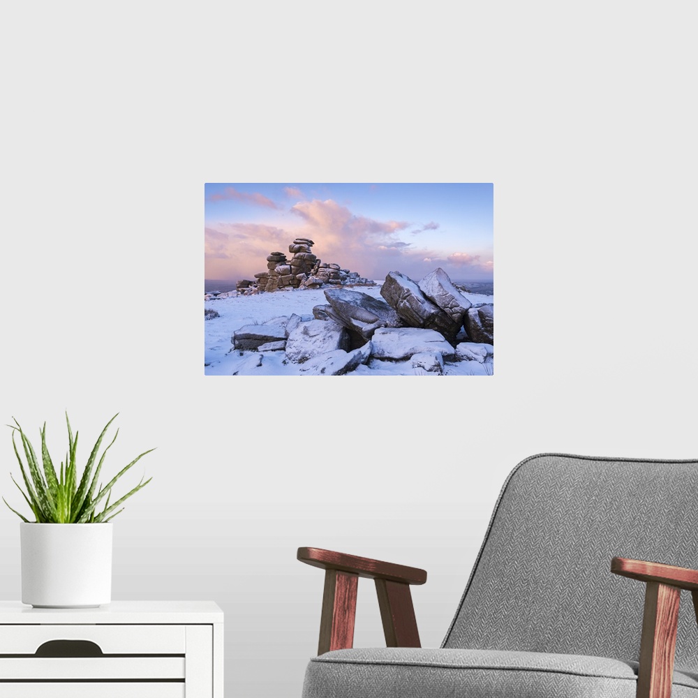 A modern room featuring Sunrise above covered rocks at Great Staple Tor, Dartmoor, Devon, England. Winter