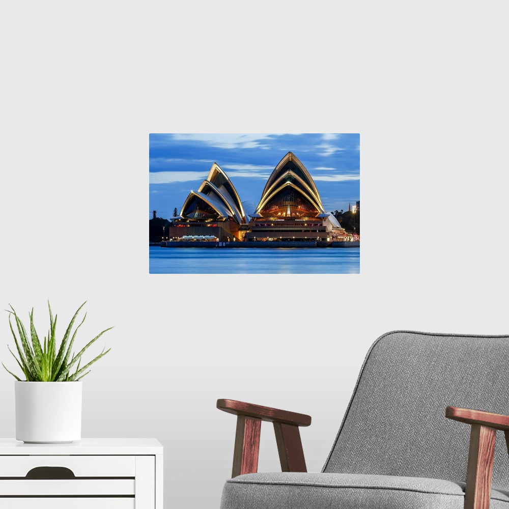 A modern room featuring Sydney Opera House at dusk, Sydney, New South Wales, Australia.