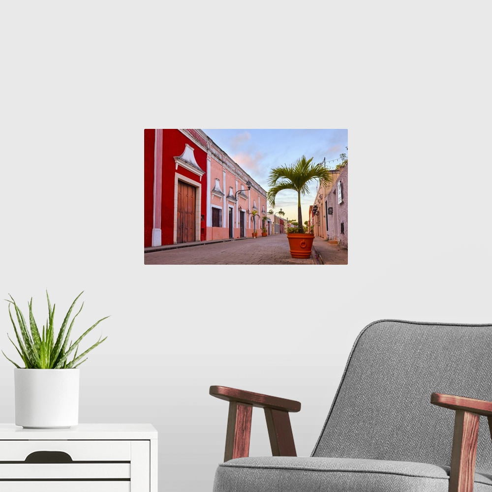 A modern room featuring The Calzada de los Frailes street at sunrise, Valladolid, Yucatan, Mexico.
