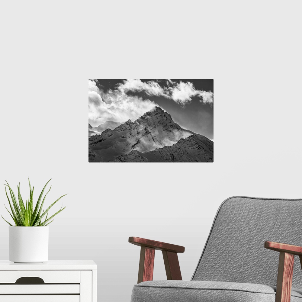 A modern room featuring The Grivola Peak during a windy day from the Couis peak, near Pila locality (Gressan municipality...