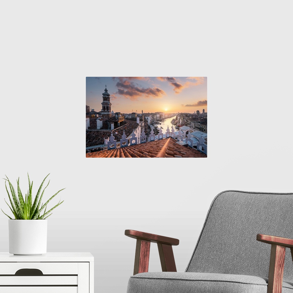 A modern room featuring The view of Canal Grande and Rialto bridge from Fondaco dei Tedeschi, during sunset. Venice, Vene...