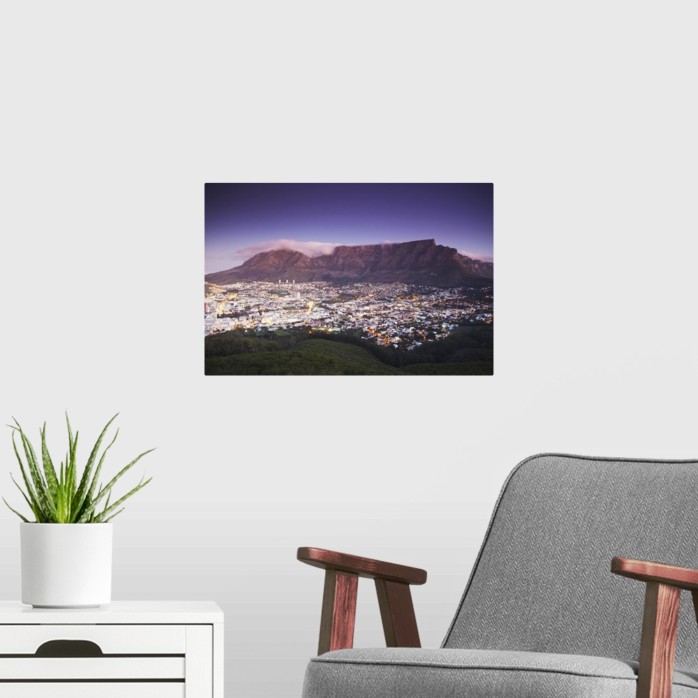 A modern room featuring Table Mountain at dusk, Cape Town, Western Cape, South Africa