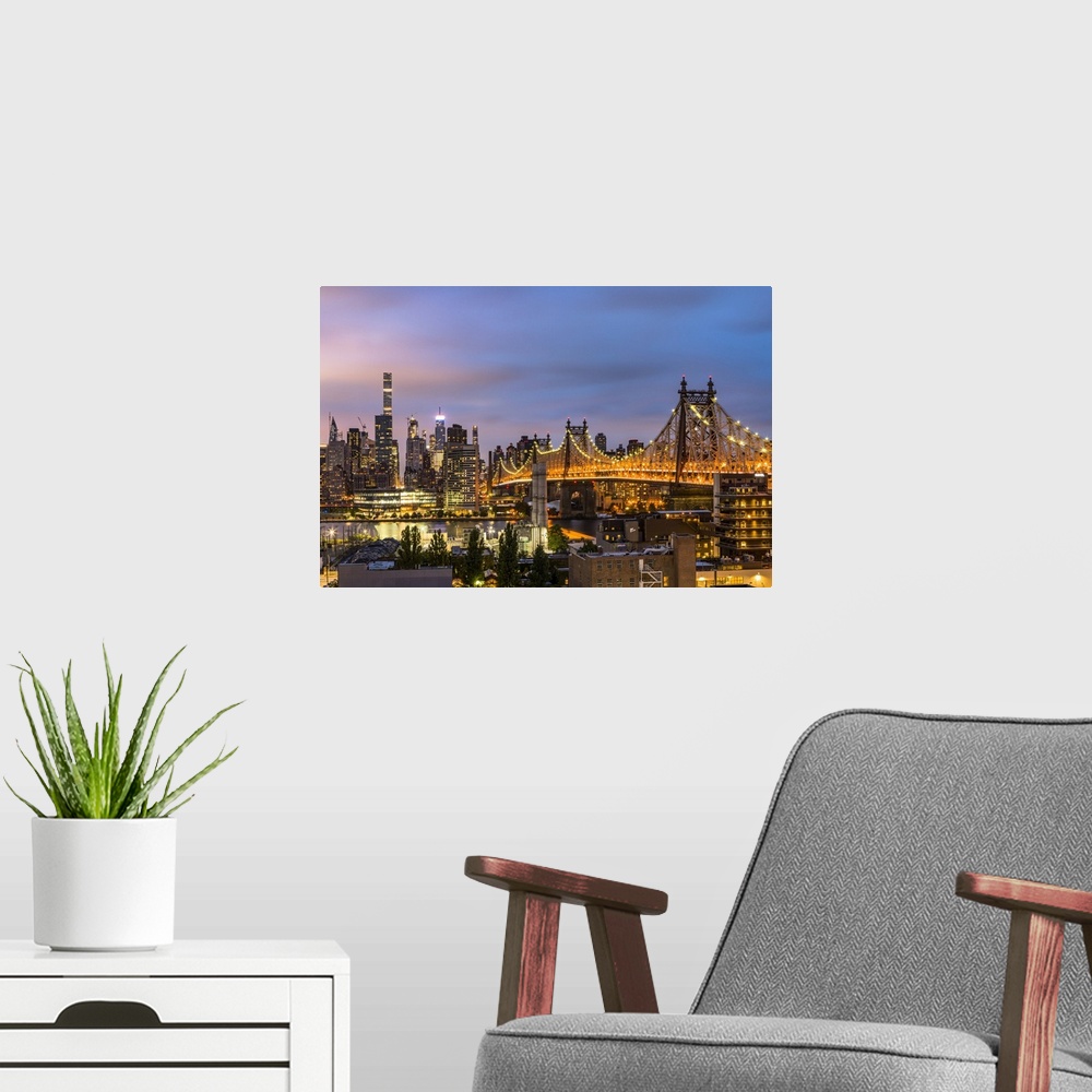 A modern room featuring View of Midtown Manhattan in the evening from Long Island City, New York City, USA