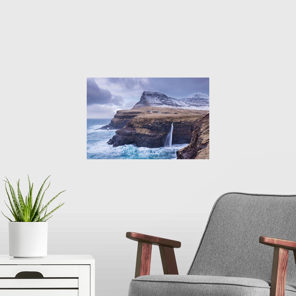 A modern room featuring Wintry conditions at Gasadalur on the island of Vagar, Faroe Islands, Denmark, Europe. Winter (Ma...