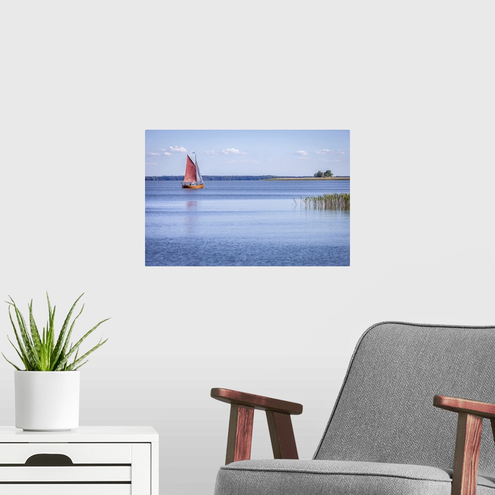 A modern room featuring Zeesen boat on the bay near Althagen, Mecklenburg-Western Pomerania, Northern Germany, Germany