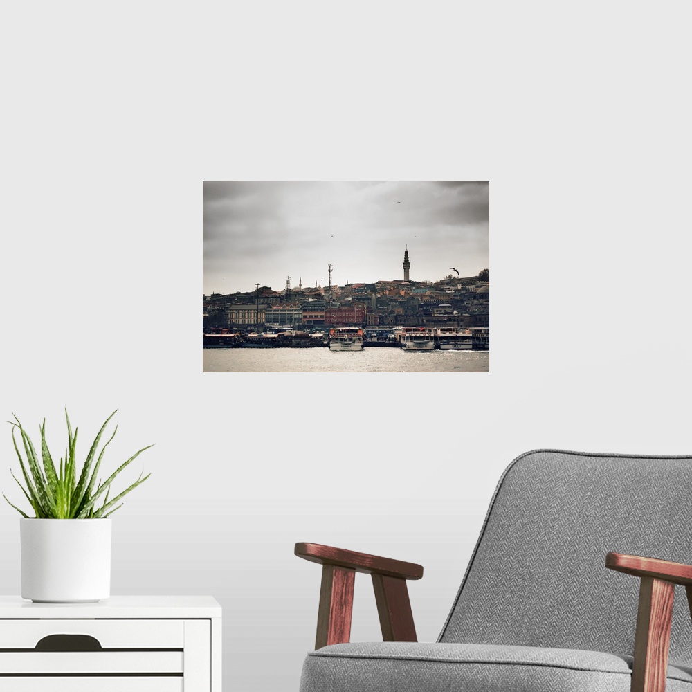 A modern room featuring An offshore look of Istanbul from the Bosphorus River looking onto the mainland. Istanbul's skyli...
