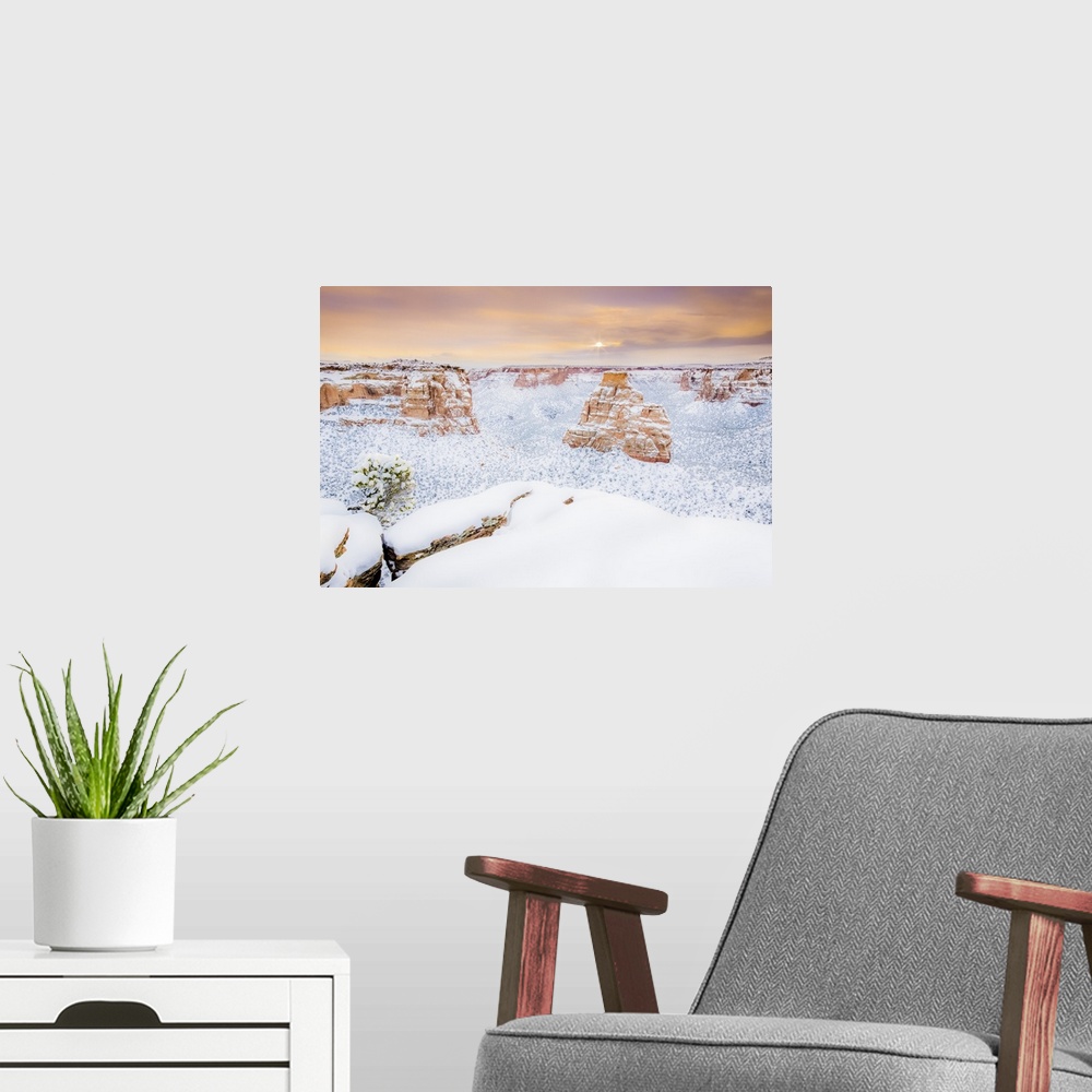A modern room featuring Sun rises over the landscape of fresh snow, Colorado National Monument
