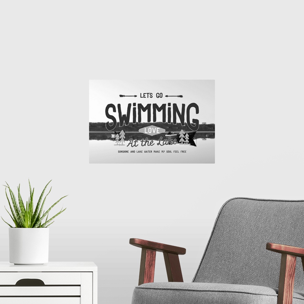 A modern room featuring Typography artwork reading "Let's go swimming, love at the lake," over a black and white image of...