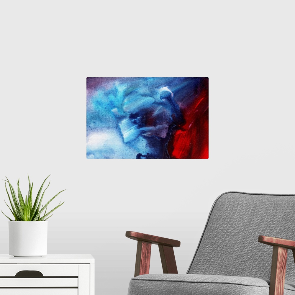 A modern room featuring Abstract painting on canvas of warm colors meeting cool colors on canvas.