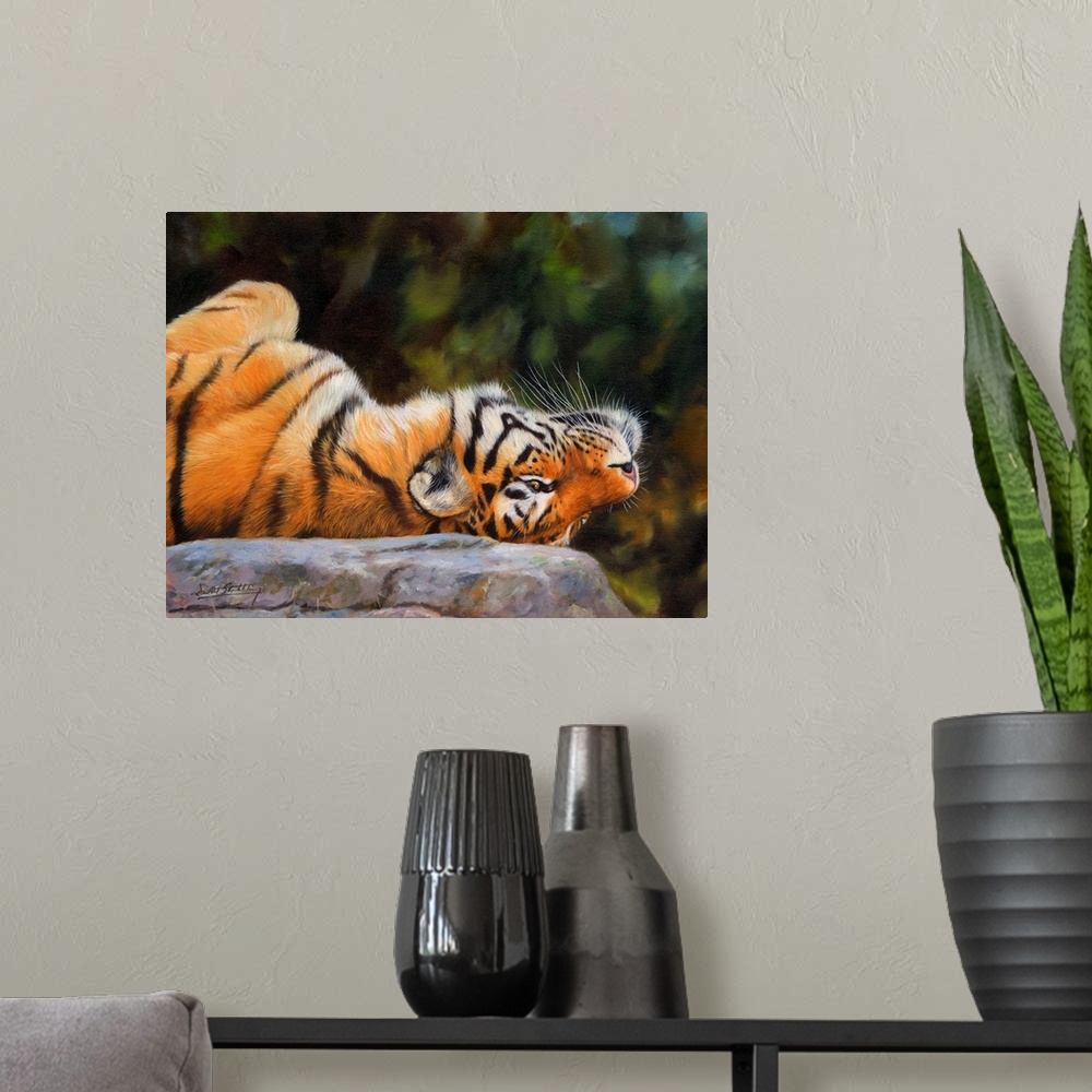A modern room featuring Painting of a Siberian tiger playfully laying upside down on a rock.