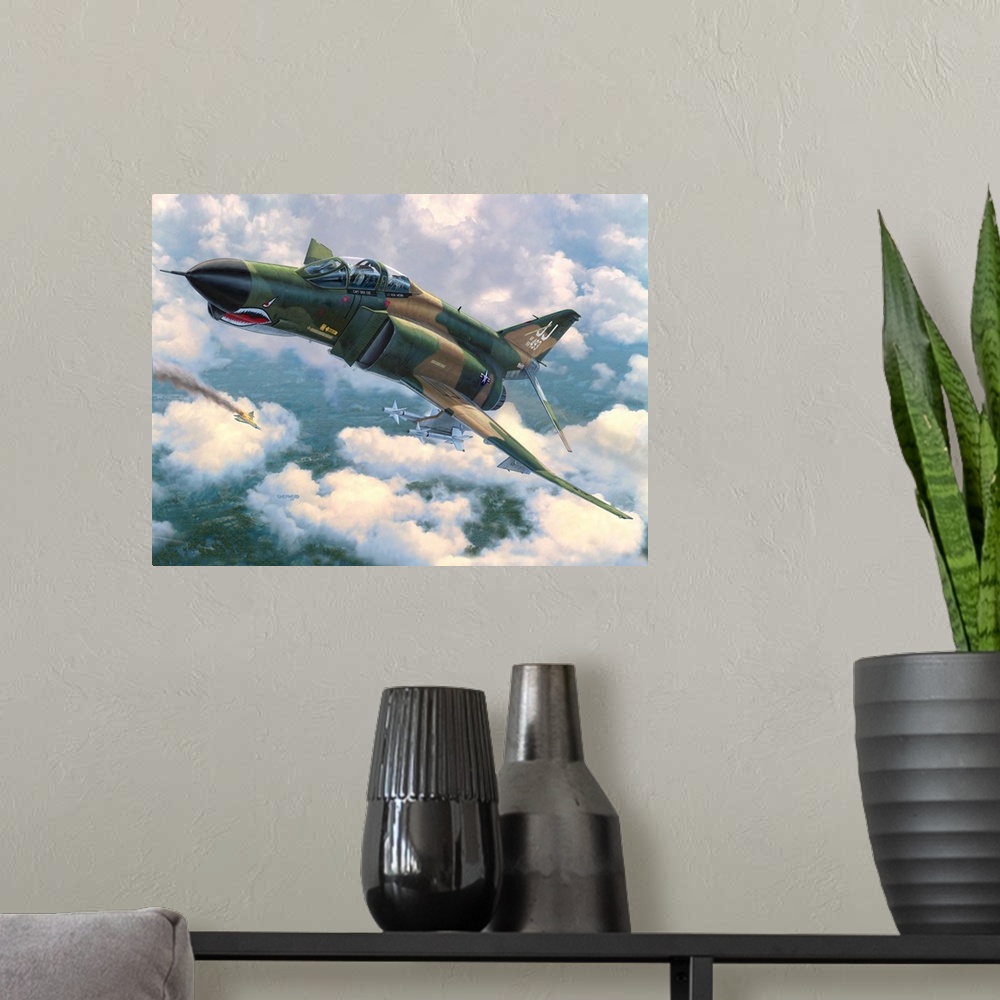 A modern room featuring An F-4E Phantom II flies in front of broken clouds over a tree covered jungle terrain with a Nort...