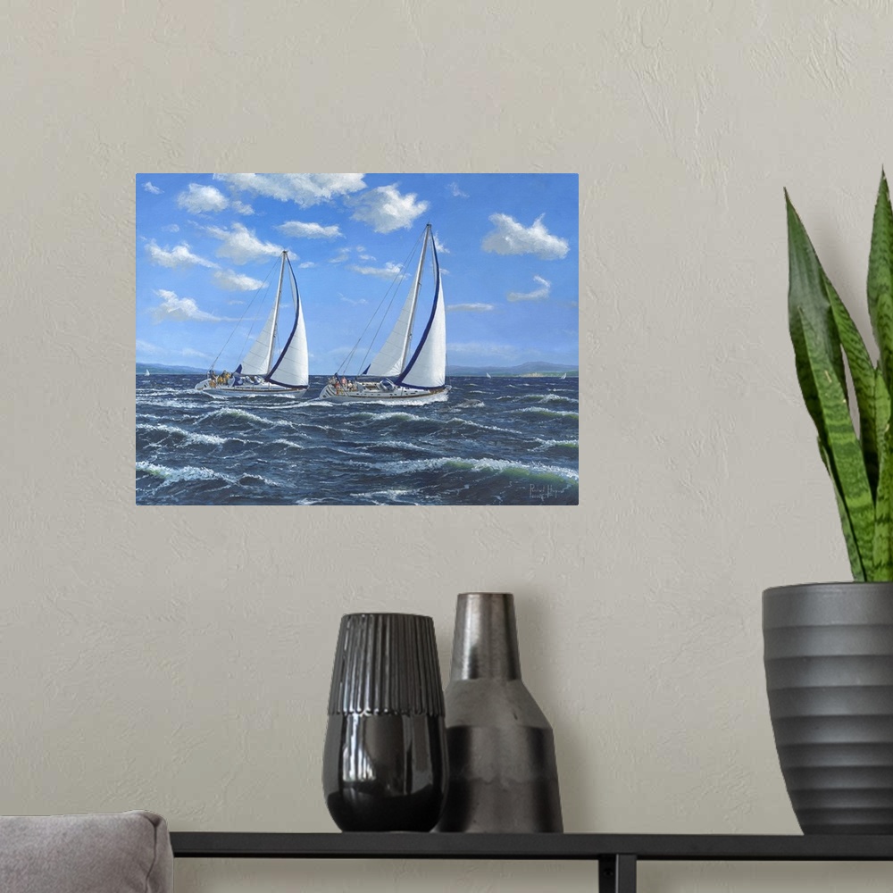 A modern room featuring Contemporary artwork of two sailboats on open seas.