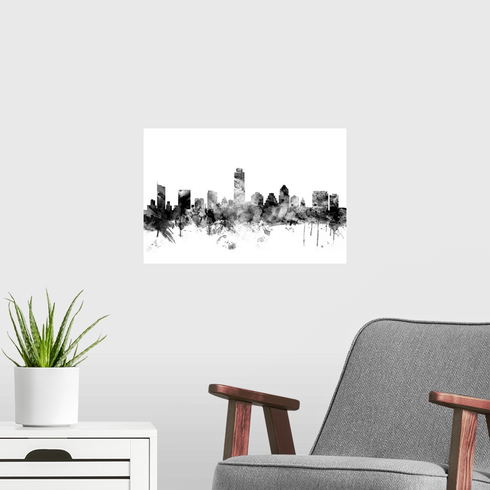 A modern room featuring Contemporary artwork of the Austin city skyline in black watercolor paint splashes.