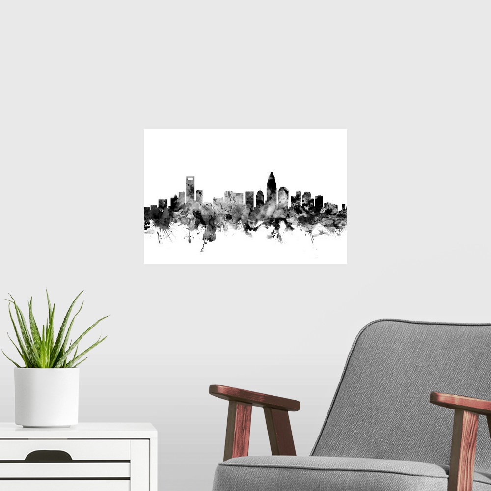 A modern room featuring Contemporary artwork of the Charlotte city skyline in black watercolor paint splashes.