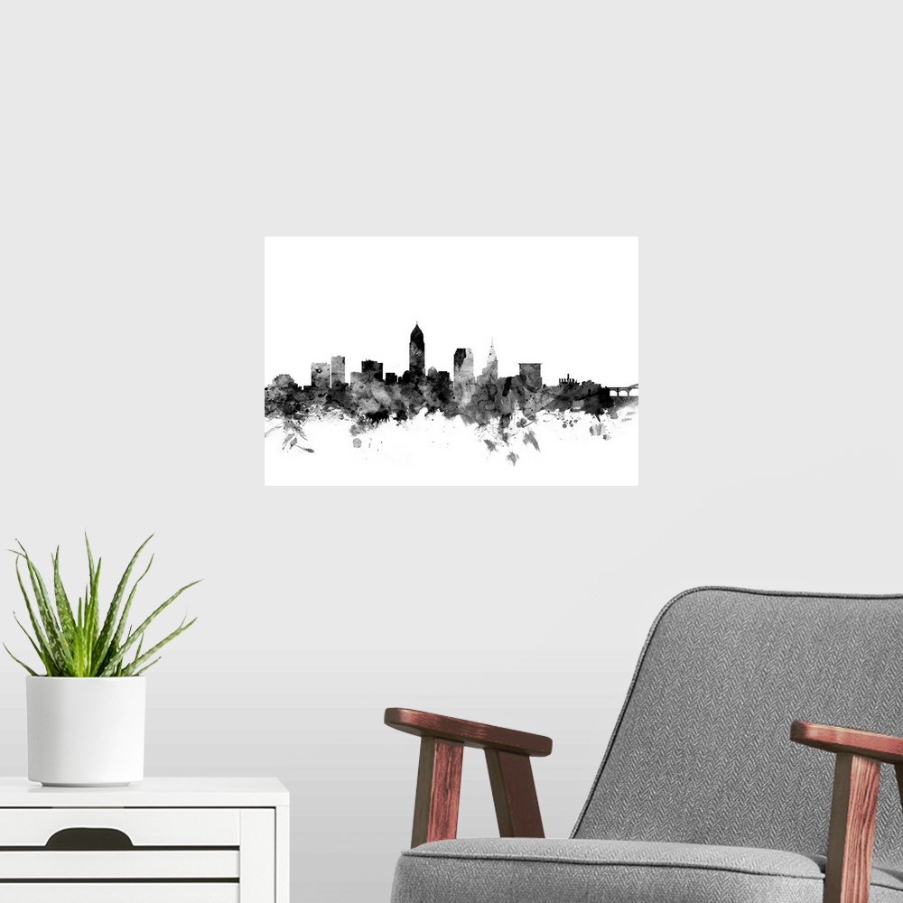A modern room featuring Contemporary artwork of the Cleveland city skyline in black watercolor paint splashes.