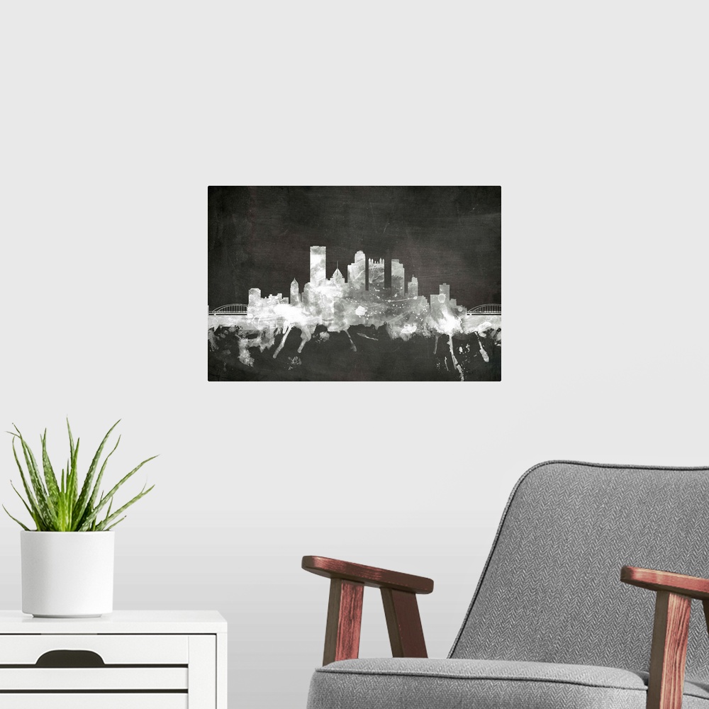 A modern room featuring Smokey dark watercolor silhouette of the Pittsburgh city skyline against chalkboard background.