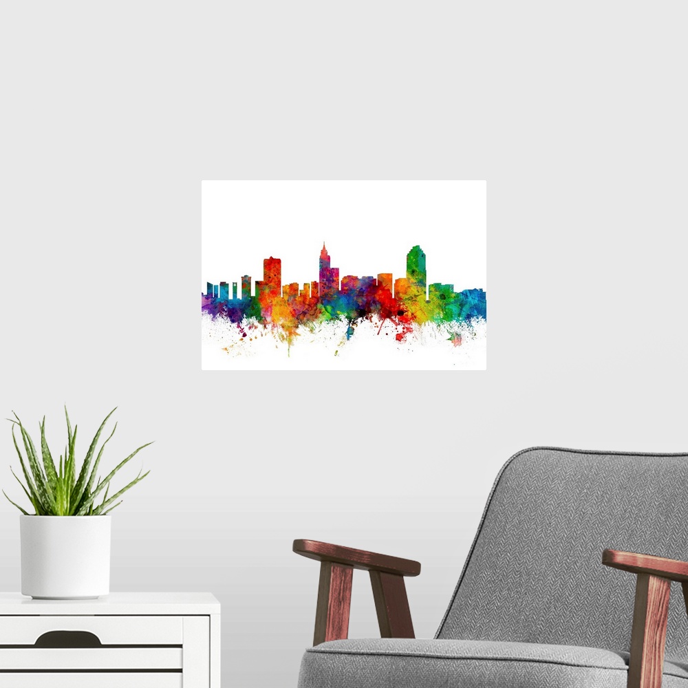 A modern room featuring Colorful watercolor splattered silhouetted of the Raleigh city skyline.