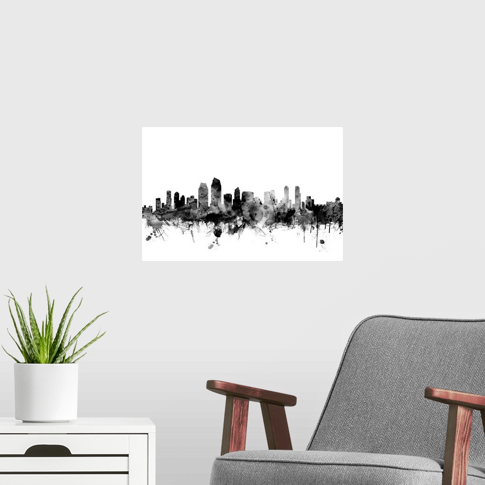 A modern room featuring Contemporary artwork of the San Diego city skyline in black watercolor paint splashes.