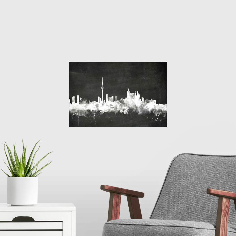 A modern room featuring Smokey dark watercolor silhouette of the Toronto city skyline against chalkboard background.