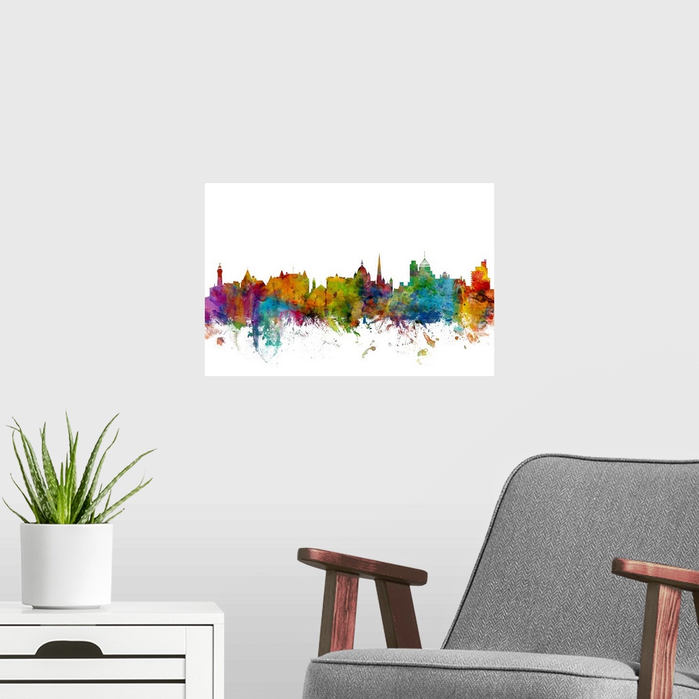 A modern room featuring Watercolor artwork of the Victoria skyline against a white background.