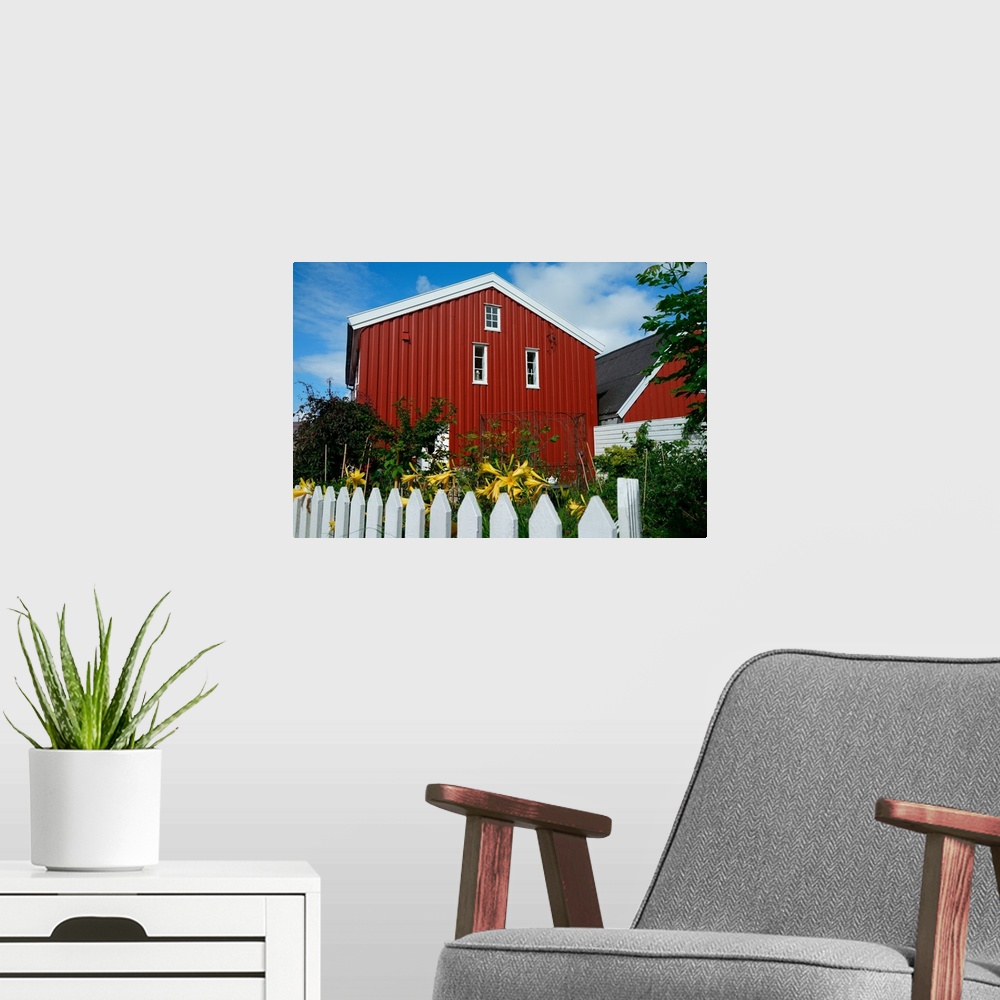 A modern room featuring Norway, Skudeneshavn: red house and white fence