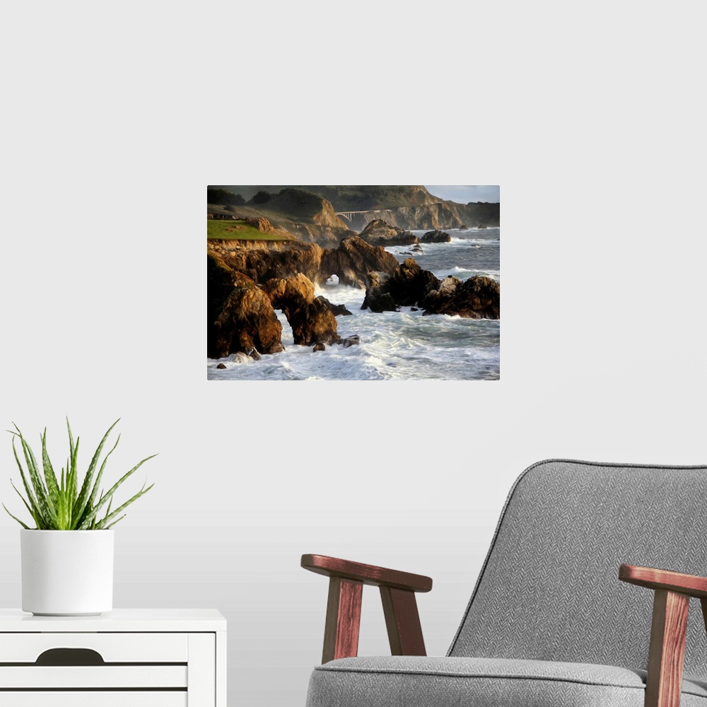 A modern room featuring A spectacular view of the rugged coastline in Big Sur with the Rocky Creek Bridge in the distance...