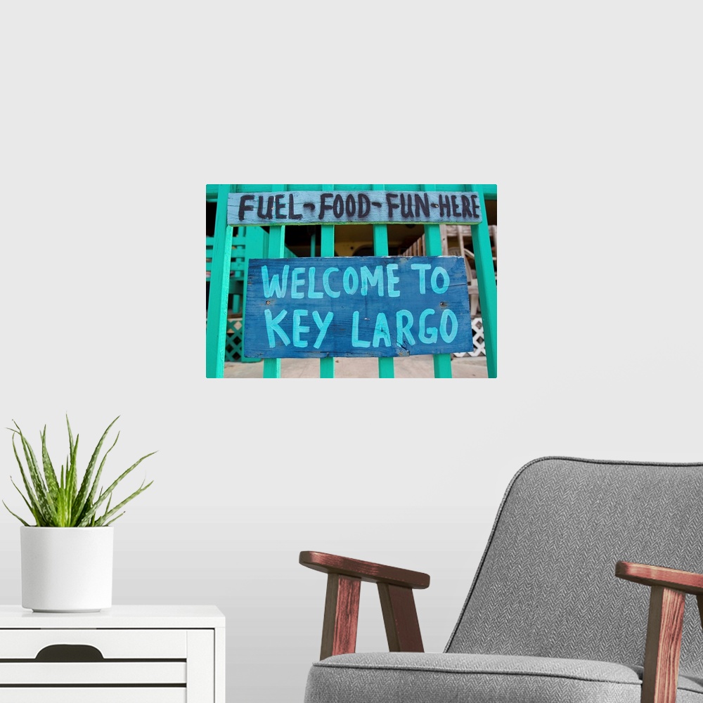 A modern room featuring A colorful sign welcoming people to Key Largo.