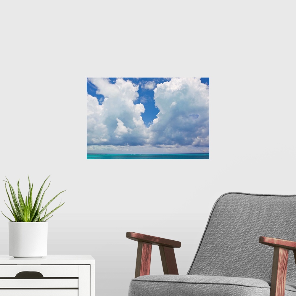 A modern room featuring Large clouds over Grace Bay, in the Turks and Caicos Islands.