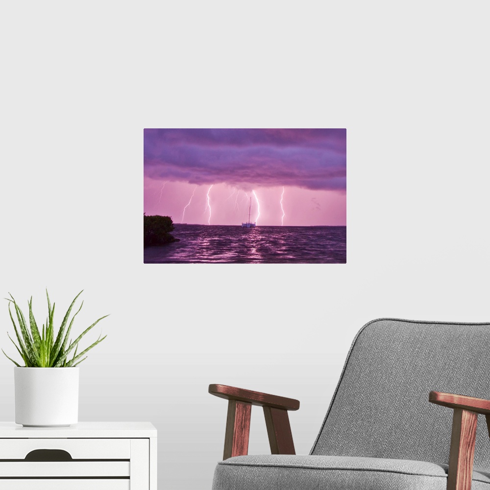 A modern room featuring Lightning bolts striking the ocean, and almost hitting a sailboat.