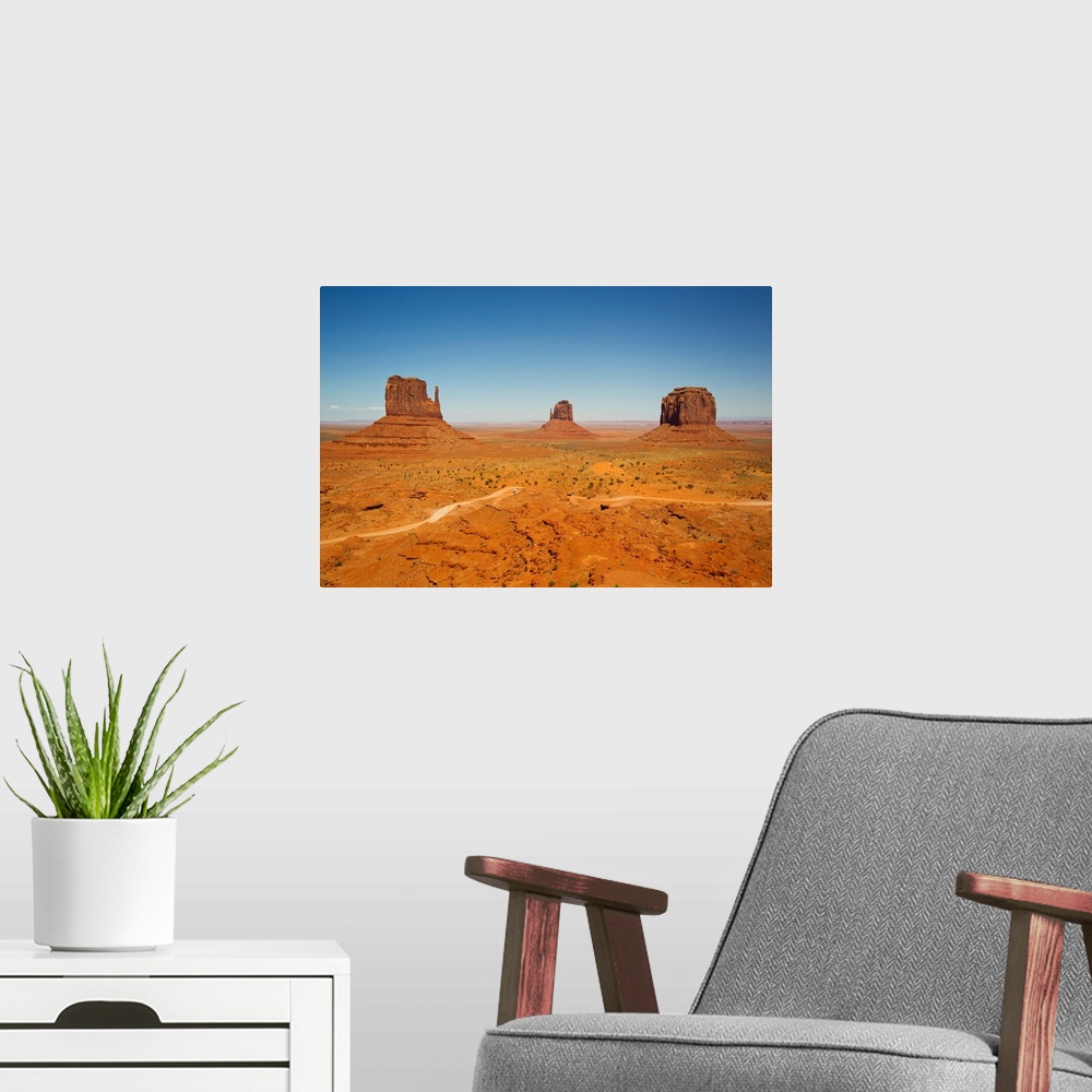 A modern room featuring The rock formation called Mittens, and desert landscape.