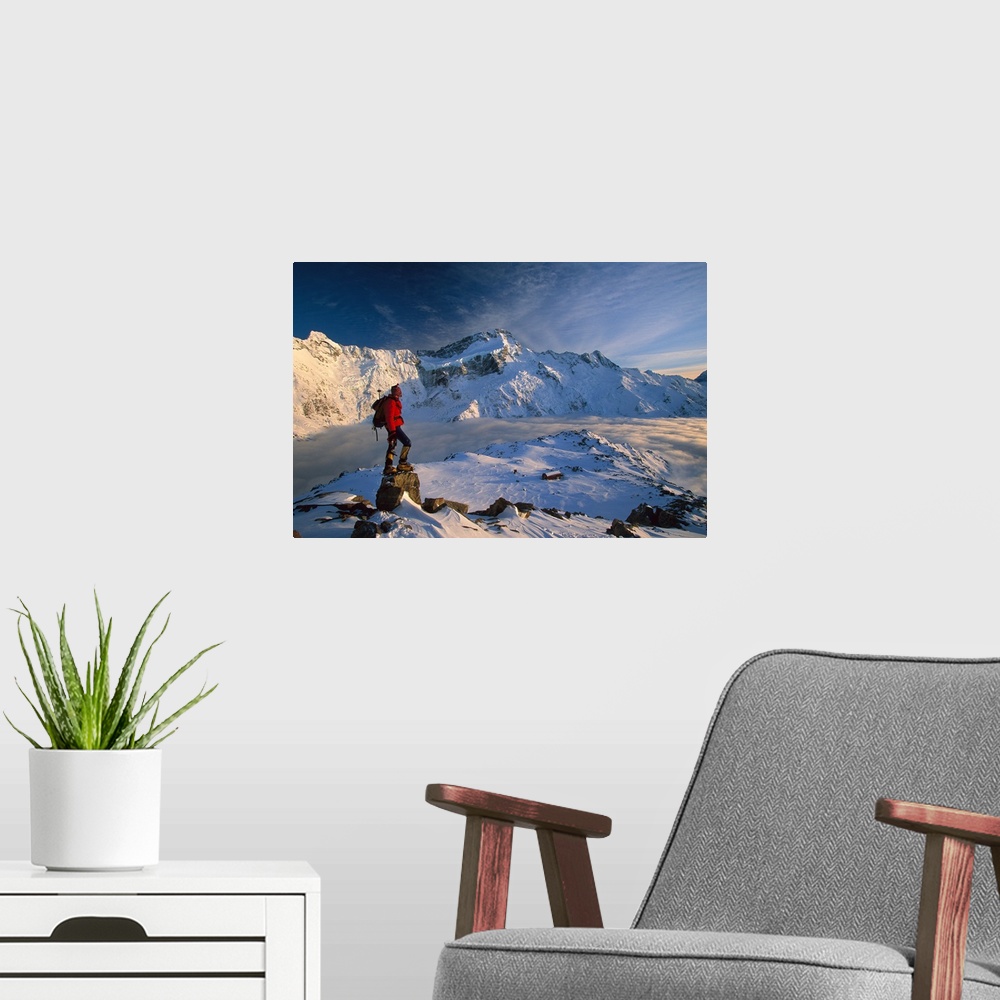A modern room featuring Mt Sefton, climber at dawn above Mueller hut and cloud-filled Mueller Glacier, Mt Cook National P...