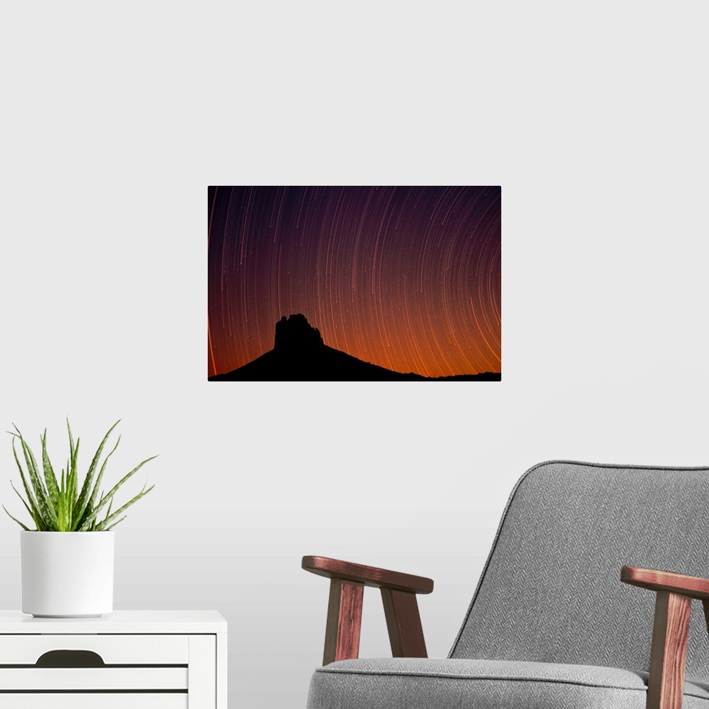 A modern room featuring Startrails over Shiprock in the four corners region of the Southwest, New Mexico