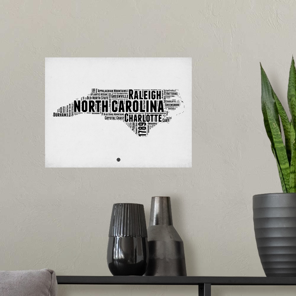 A modern room featuring Typography art map of the US state North Carolina.