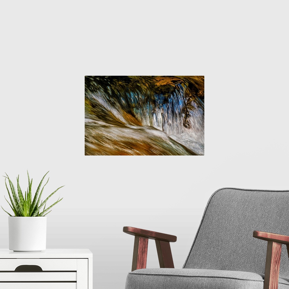 A modern room featuring A photo of a running water with a reflection of a blue sky.