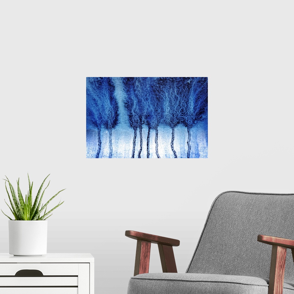 A modern room featuring Abstract artistic photograph of blue paint dripping down a surface.