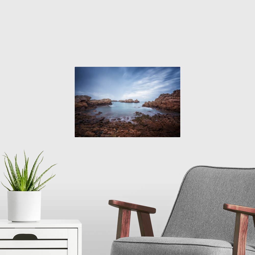 A modern room featuring Fine art photo of the rocky shoreline of an island in the north of France.