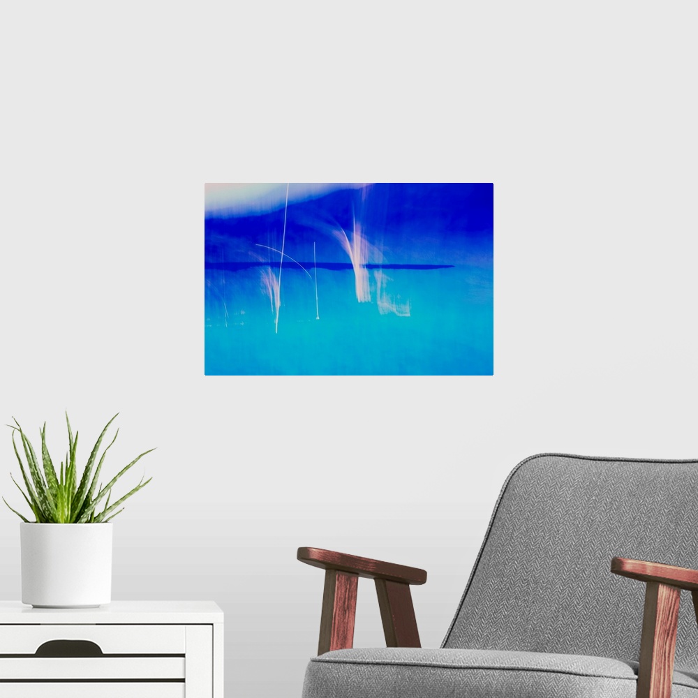 A modern room featuring Abstract photograph created with blue and white hues.