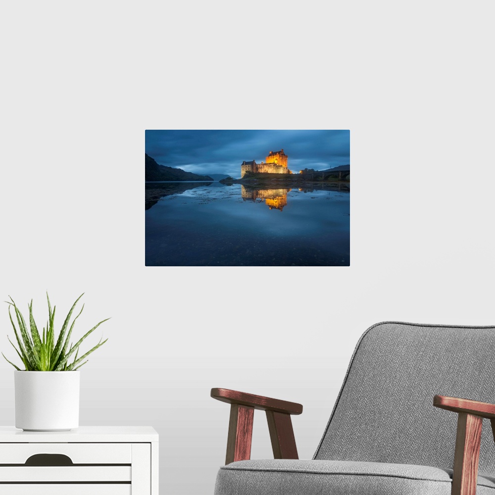 A modern room featuring Photograph of old castle on Eilean Donan Island over Loch Duich, with mountains in the distant ba...