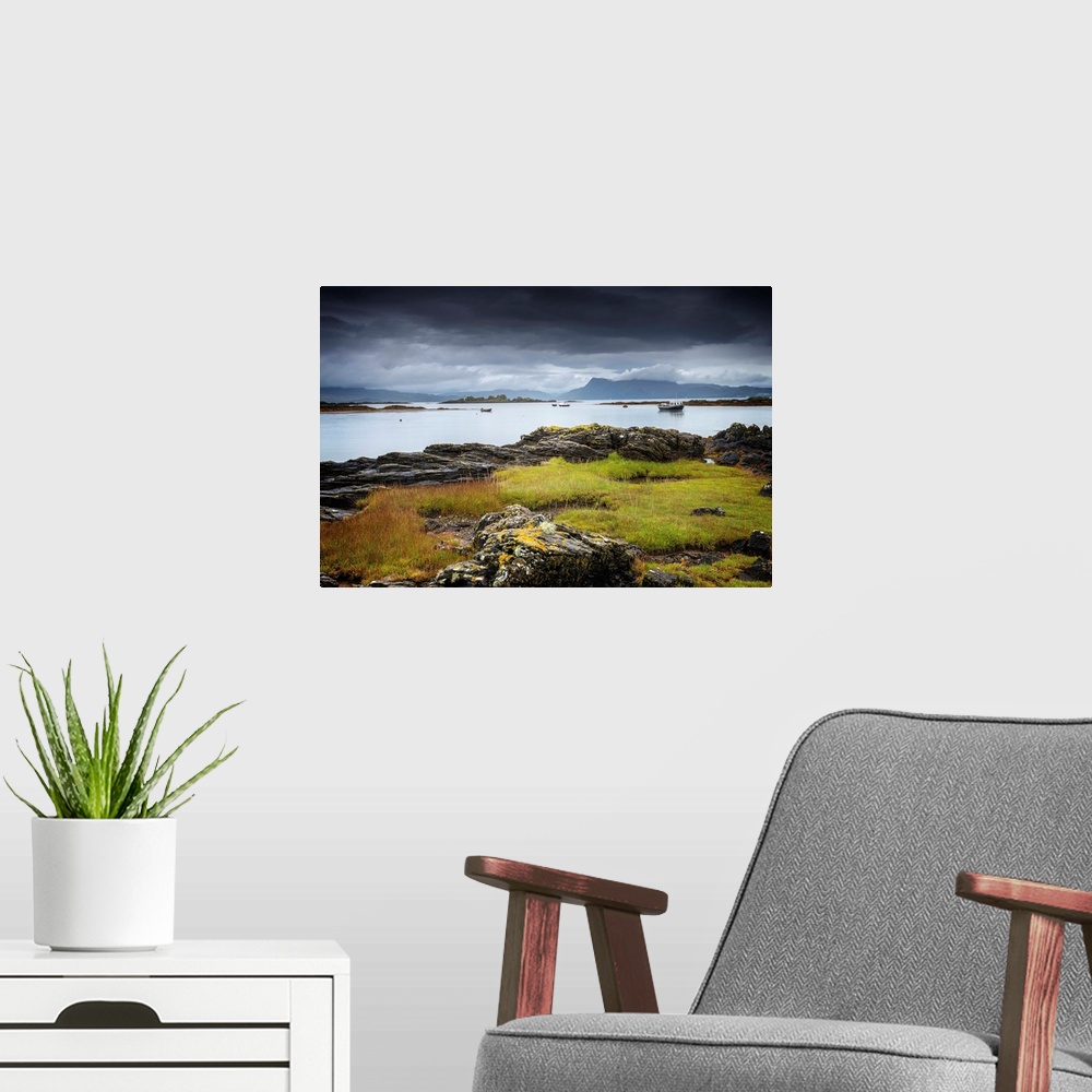 A modern room featuring Fine art photo of a rocky coast under a dark stormy sky.