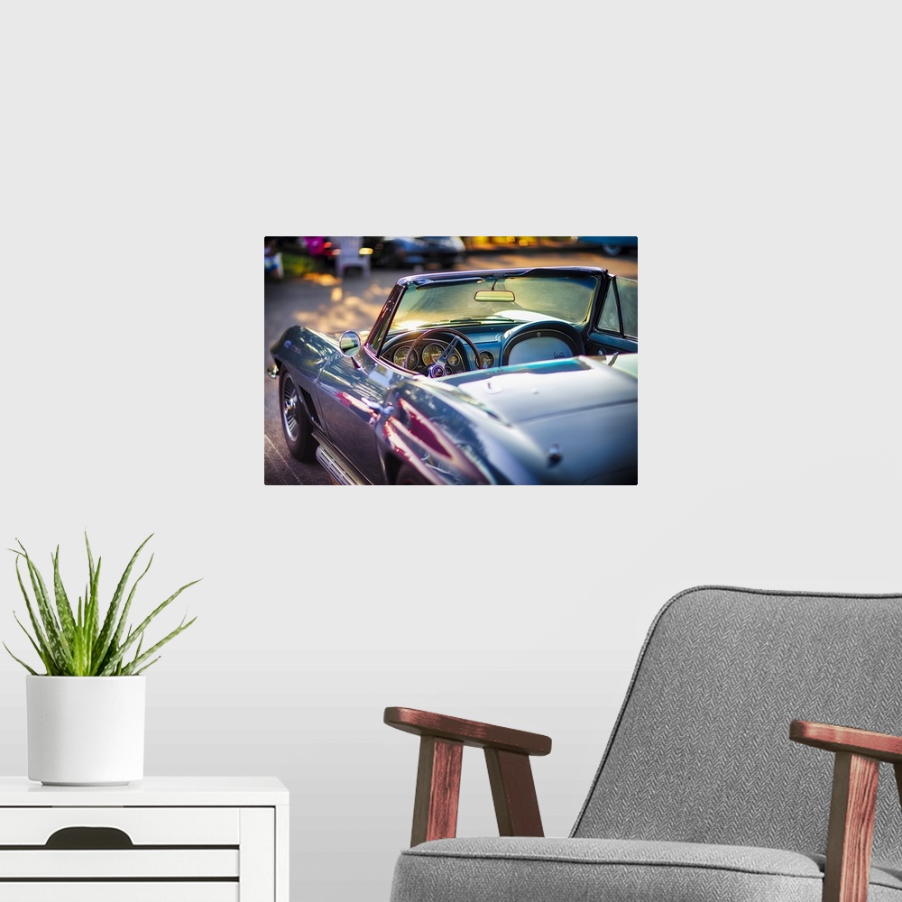 A modern room featuring Driver's Side View of a Classic 1965 Chevrolet Corvette Stingray Roadster Interior with the Instr...