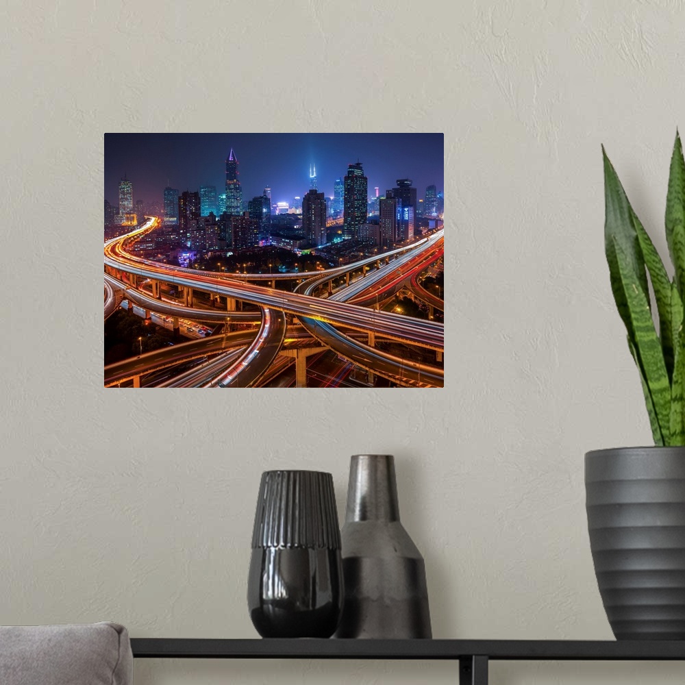 A modern room featuring Horizontal city skyline of Shanghai, China at night.