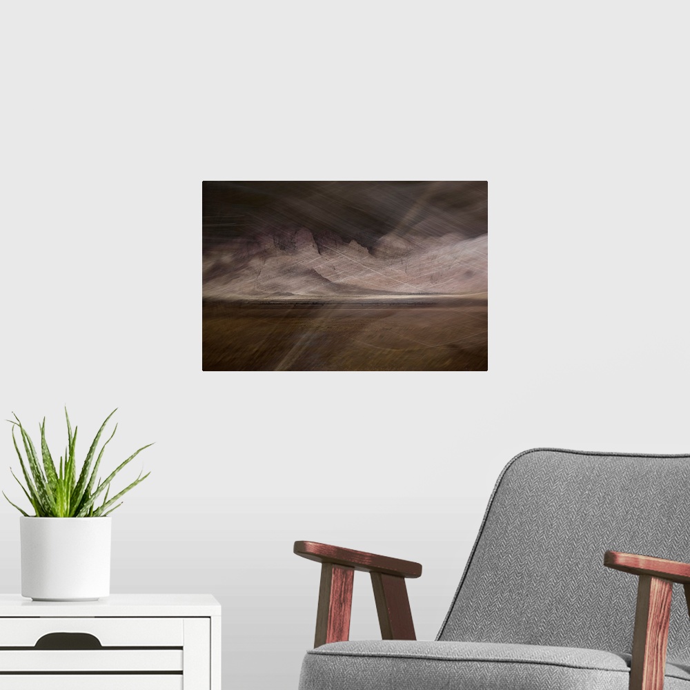 A modern room featuring Abstract image of a desert storm with thin lines on top creating movement and a rocky textured ba...